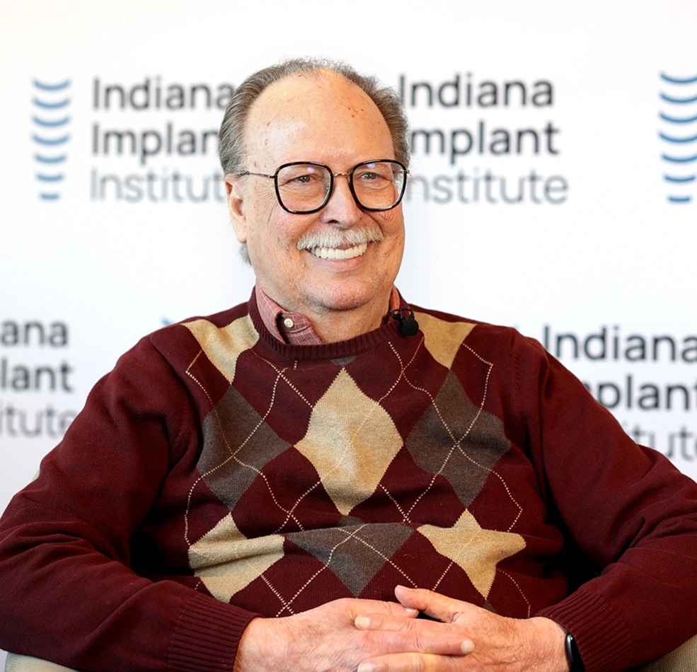 Russell smiling confidently after dental implant treatment at Indiana Implant Institute
