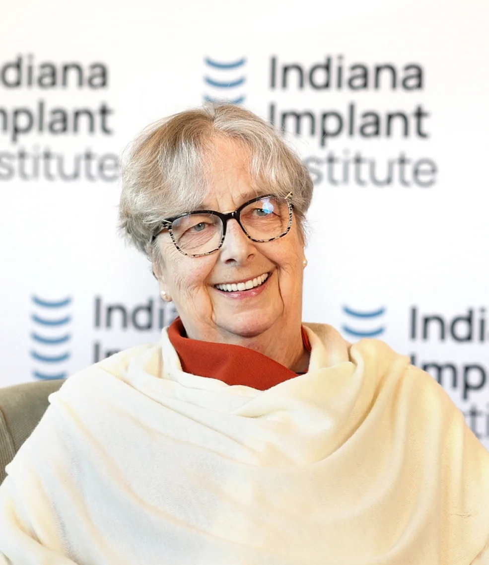 Pamela smiling confidently after dental implant treatment at Indiana Implant Institute.